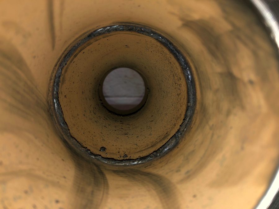 View down the bore of a carbon steel pipe showing the internal root pass